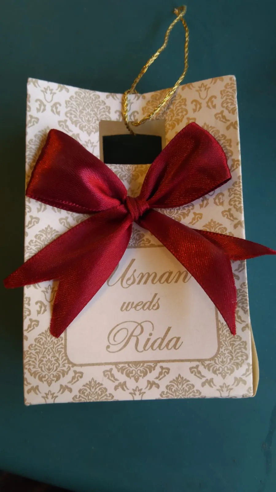 Paper handbag bid bag with satin ribbon and custom printed name tag